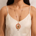 Albeli Botanical Resin Medallion in Coral Horseshoe Pendant necklace